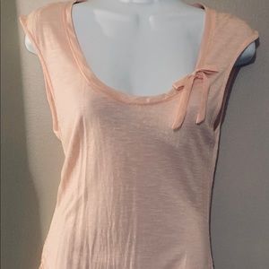 Peach colored short sleeve shirt